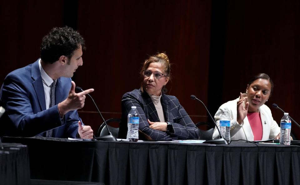 Aaron Regunberg speaks past Ana Quezada to spar with Sabina Matos during the first hour of the 2023 Rhode Island CD1 Special Election Candidate Forum Tuesday evening at Rhode Island College.