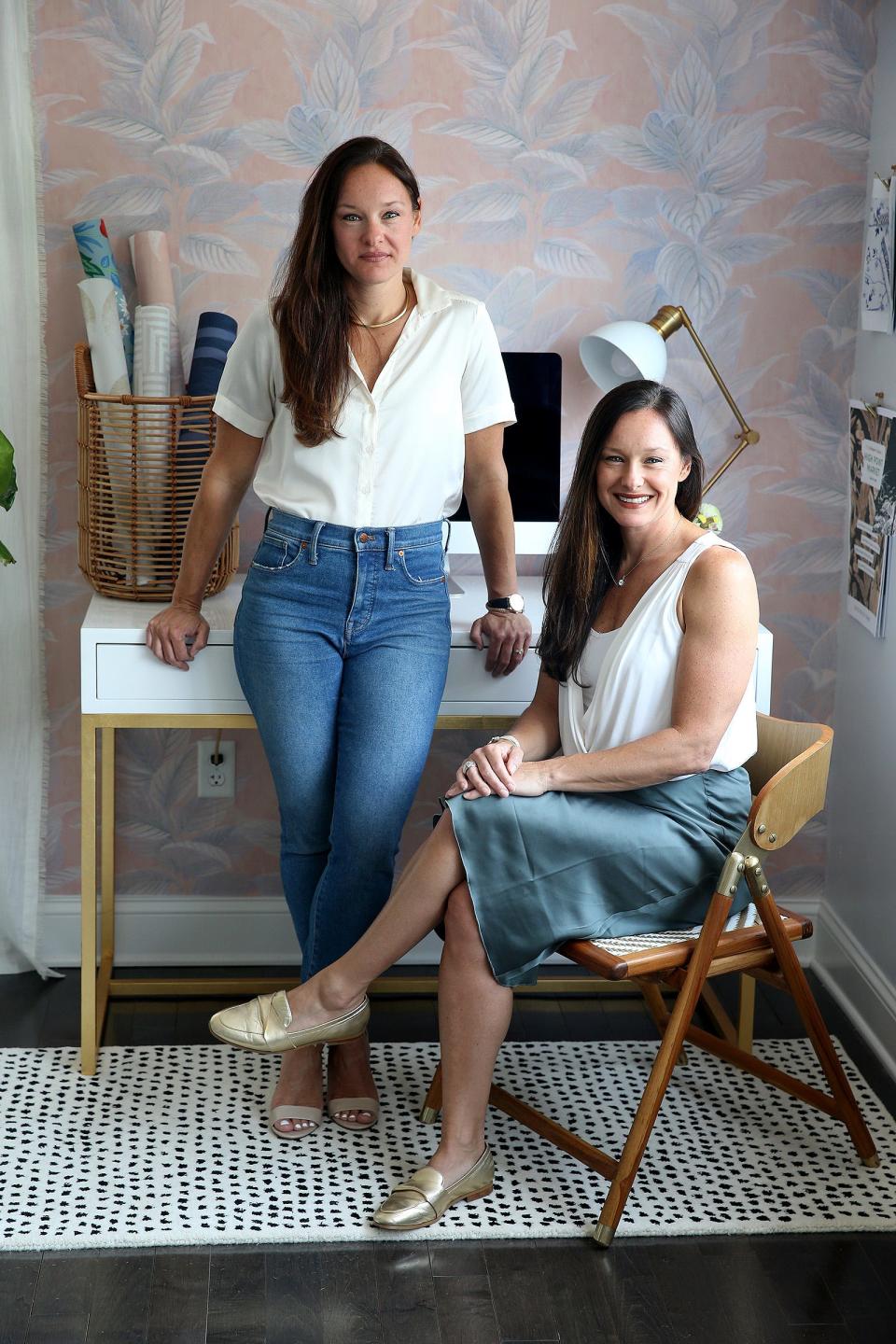 Tempaper co-founders (and sisters) Julia Au (seated, CEO) and Jennifer Matthews (CCO) are shown Monday, July 18, 2022. The Brick business sells peel-and-stick wallpaper in a variety of patterns and prices.