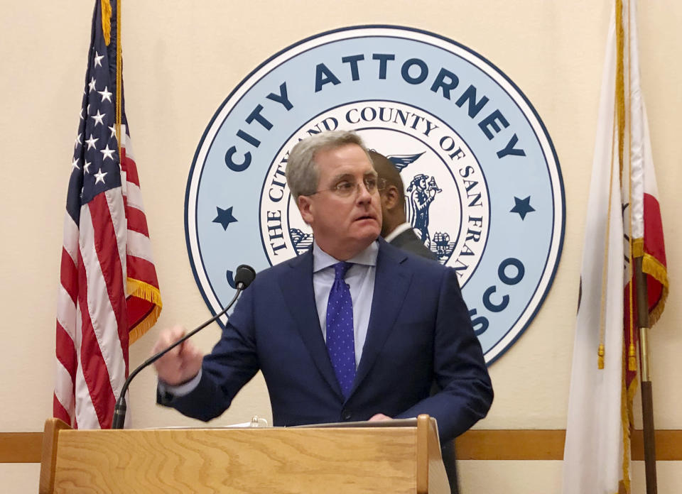 San Francisco City Attorney Dennis Herrera announces that he's cracking down on the sale of e-cigarettes that he says aggressively target youth, at a City Hall news conference Tuesday, March 19, 2019. Legislation to be introduced would ban the sale of e-cigarettes anywhere in the city and county of San Francisco until the FDA has reviewed the product for sale. (AP Photo/Janie Har)