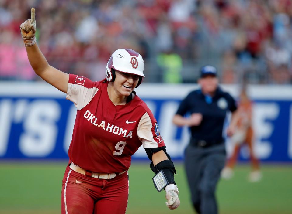 OU's Kinzie Hansen (9) celebrates a home run against Texas in the fifth inning of Game 2 of the WCWS championship series.