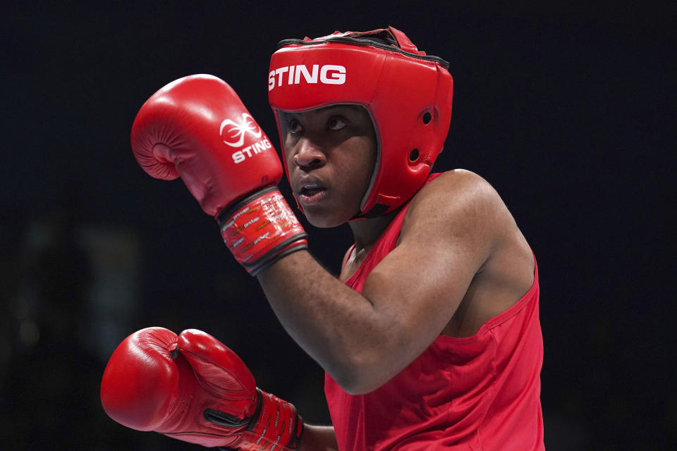 Boxer Cindy Ngamba of Cameroon trains in Sheffield, England, on Jan. 18, 2024. Cindy Ngamba is one of the members of the Refugee Team for the Paris Olympics which will feature 36 athletes from 11 countries in 12 sports. They were picked from more than 70 scholarships, International Olympic Committee president Thomas Bach said at the team announcement on Thursday, May 2, 2024. (Martin Rickett/PA via AP)