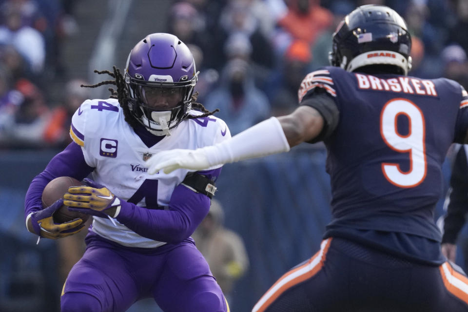 FILE - Minnesota Vikings running back Dalvin Cook runs against the Chicago Bears during the first half of an NFL football game on Jan. 8, 2023, in Chicago. The Minnesota Vikings are parting ways with the star running back for salary cap savings after his fourth consecutive season surpassing the 1,000-yard rushing mark. Cook has been informed he will be released, a person familiar with the team’s decision told The Associated Press on Thursday, June 8. (AP Photo/Nam Y. Huh, File)