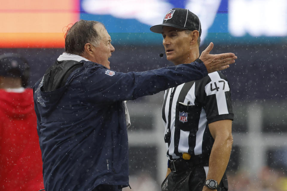 New England Patriots head coach Bill Belichick, left, speaks with line judge Tim Podraza (47) in the first half of an NFL football game against the Philadelphia Eagles, Sunday, Sept. 10, 2023, in Foxborough, Mass. (AP Photo/Michael Dwyer)