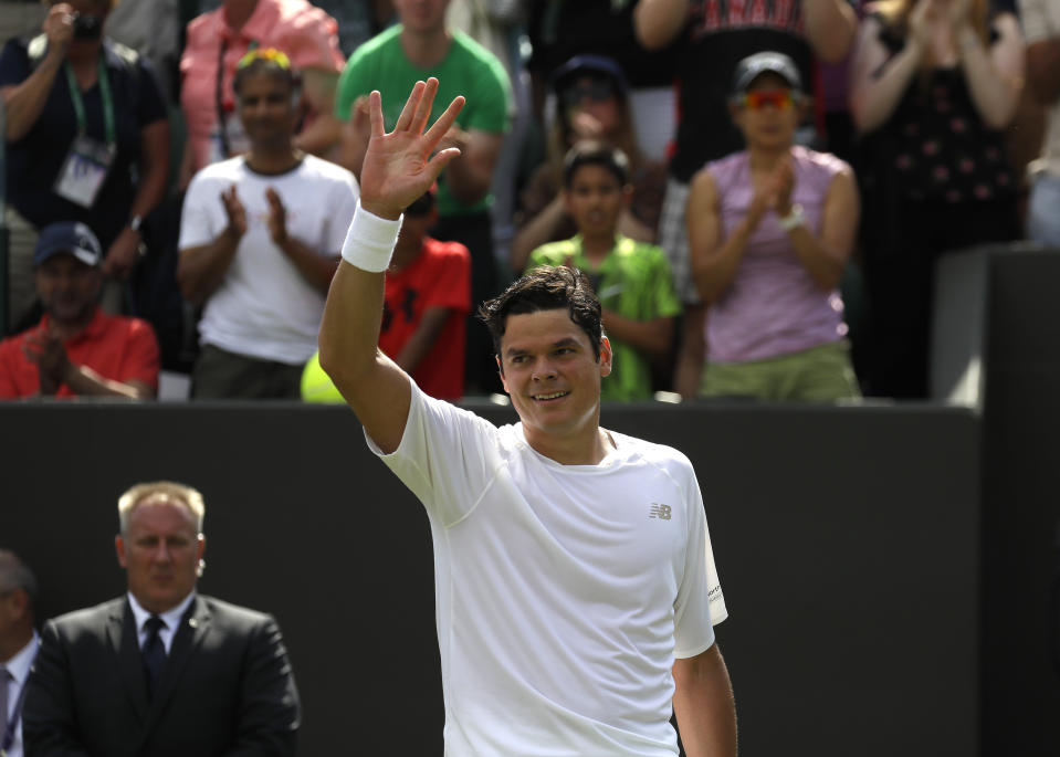 Canada's Milos Raonic celebrates after beating Netherland's Robin Haase in a Men's singles match during day three of the Wimbledon Tennis Championships in London, Wednesday, July 3, 2019. (AP Photo/Kirsty Wigglesworth)