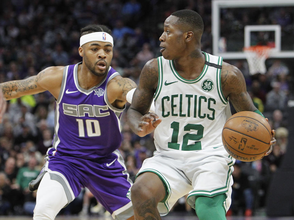 Celtics guard Terry Rozier (right) has given fantasy owners a lift after filling in for Kyrie Irving. (AP)