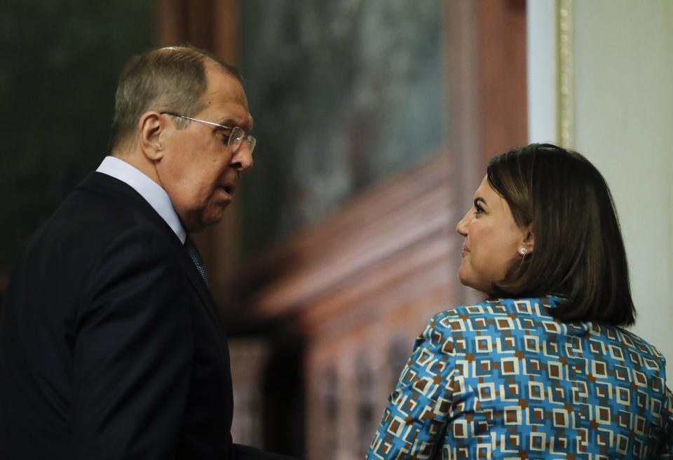 Russian Foreign Minister Sergey and Libyan Foreign Minister Najla Mangoush leave a joint news conference following their talks in Moscow, Russia, Thursday, Aug. 19, 2021. (Maxim Shipenkov/Pool Photo via AP)