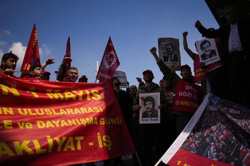 Trade union members shout slogans during Labor day celebrations at Taksim square in Istanbul, Turkey, Monday, May 1, 2023. As in previous years, police in Turkey prevented a group of demonstrators from reaching Istanbul's main square Taksim, and detained around a dozen protesters. Meanwhile, small groups were allowed to enter Taksim to lay wreaths at a monument there. (AP Photo/Francisco Seco)