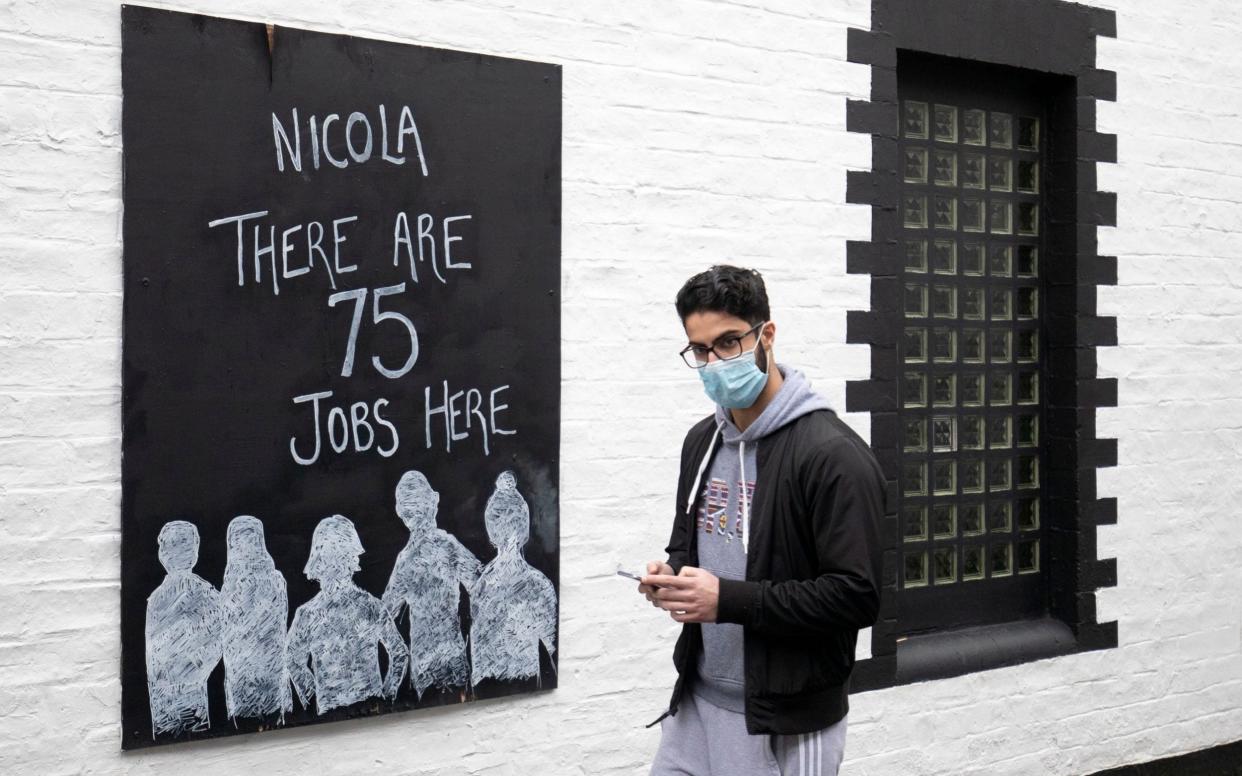 A poster displayed outside the Ubiquitous Chip restaurant in the West End of Glasgow  - Jane Barlow/PA