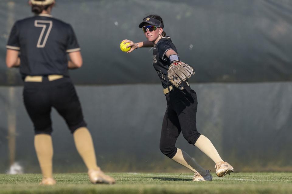 Noblesville High School freshman Izzy Zapp (17) throws the ball into the infield from right field during a sectional semi-final game against Fishers High School in an IHSAA Softball State Championship Tournament, Tuesday, May 21, 2024, at Cherry Tree Softball Complex, in Carmel.