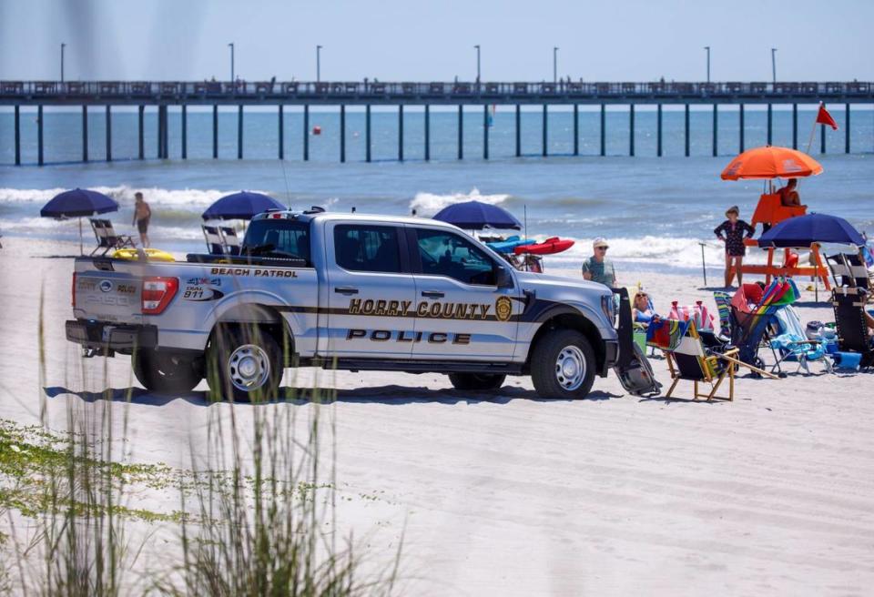 Horry County Police block off a section of the beach as South Carolina State Troopers investigated the the scene of an incident that happened yesterday near the Nash Street beach access. A female sunbather was killed after being struck by an Horry County Police vehicle. June 14, 2024.