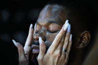 A model has make-up applied backstage before a display during the Fashion Week at Zaryadye Park near Red Square in Moscow, Russia, Thursday, June 23, 2022. More than 100 shows are being held during the week that began Monday as well as scores of speakers who are noted names in the Russian fashion industry. (AP Photo/Alexander Zemlianichenko)