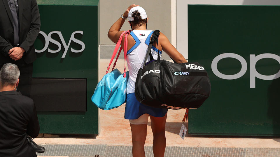 Ash Barty, pictured here leaving the court after retiring hurt against Magda Linette.