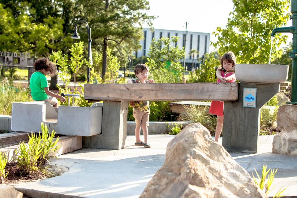 Kids playing at Discovery in Cascades Park