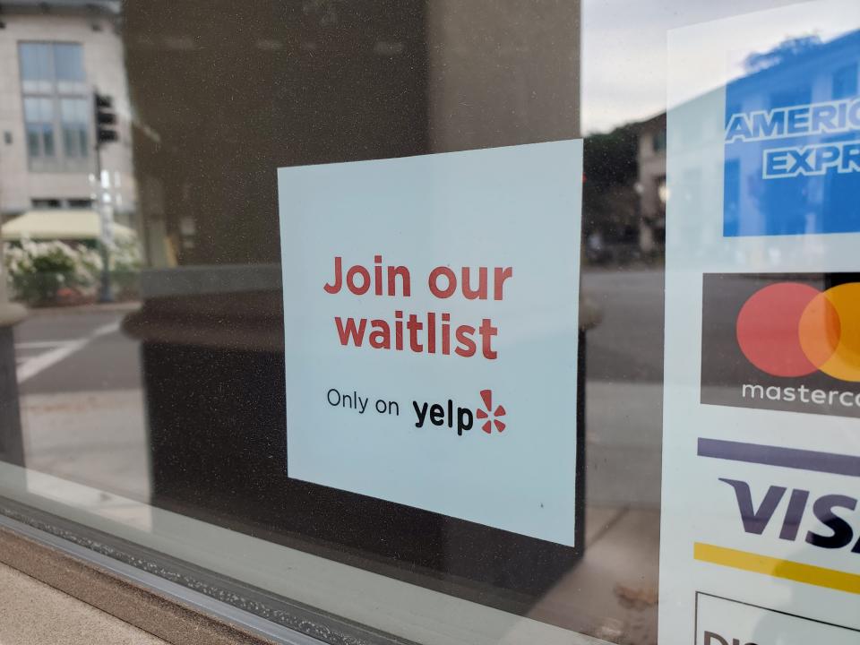 Close-up shot of a sign in a restaurant window reading 