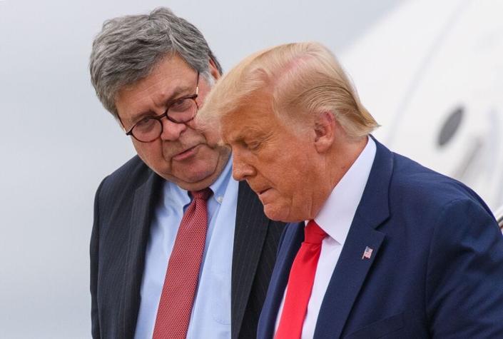 Former President Donald Trump and former Attorney General Bill Barr step off Air Force One upon arrival at Andrews Air Force Base in Maryland on Sept.  1, 2020.