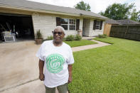 Doris Brown poses outside her home Friday, July 31, 2020, in Houston. Brown's home flooded during Harvey and she's part of a group called the Harvey Forgotten Survivors Caucus. (AP Photo/David J. Phillip)