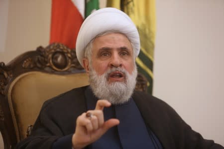 FILE PHOTO: Lebanon's Hezbollah deputy leader Sheikh Naim Qassem gestures as he speaks during an interview with Reuters in Beirut