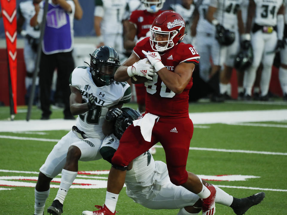 Fresno State tight end Juan Rodriguez runs in for a touchdown against Hawaii defensive back Cameron Lockridge, left, during the first half of an NCAA college football game in Fresno, Calif., Saturday, Oct. 24, 2020. (AP Photo/Gary Kazanjian)