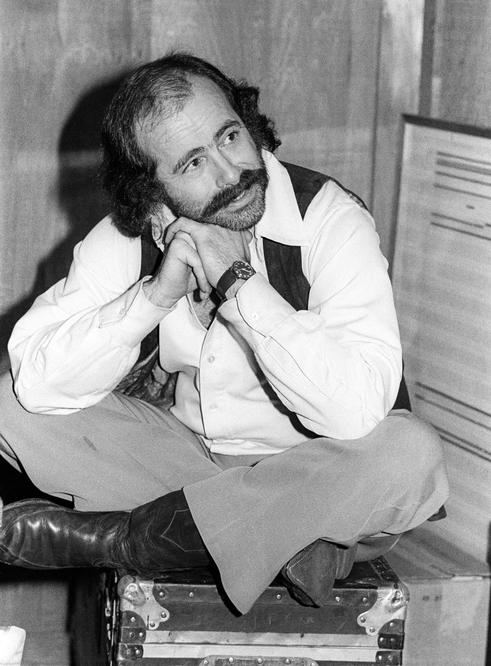 Robert Hunter poses at the Grateful Dead’s rehearsal studio, Club Front, in November 1977 in San Rafael, California. Photo credit: Ed Perlstein/Redferns/Getty Images