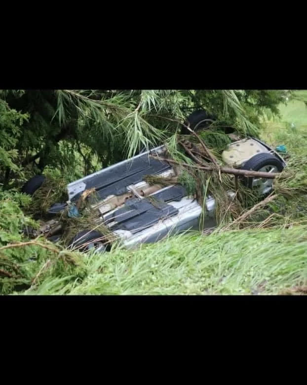 A car was swept off the road during the flooding.