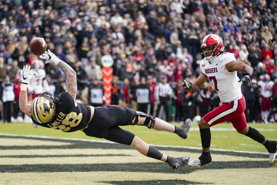 Purdue tight end Garrett Miller (88) drops pass in the end zone in front of Indiana linebacker Jacob Mangum-Farrar (7) during the first half of an NCAA college football game in West Lafayette, Ind., Saturday, Nov. 25, 2023. (AP Photo/Michael Conroy)