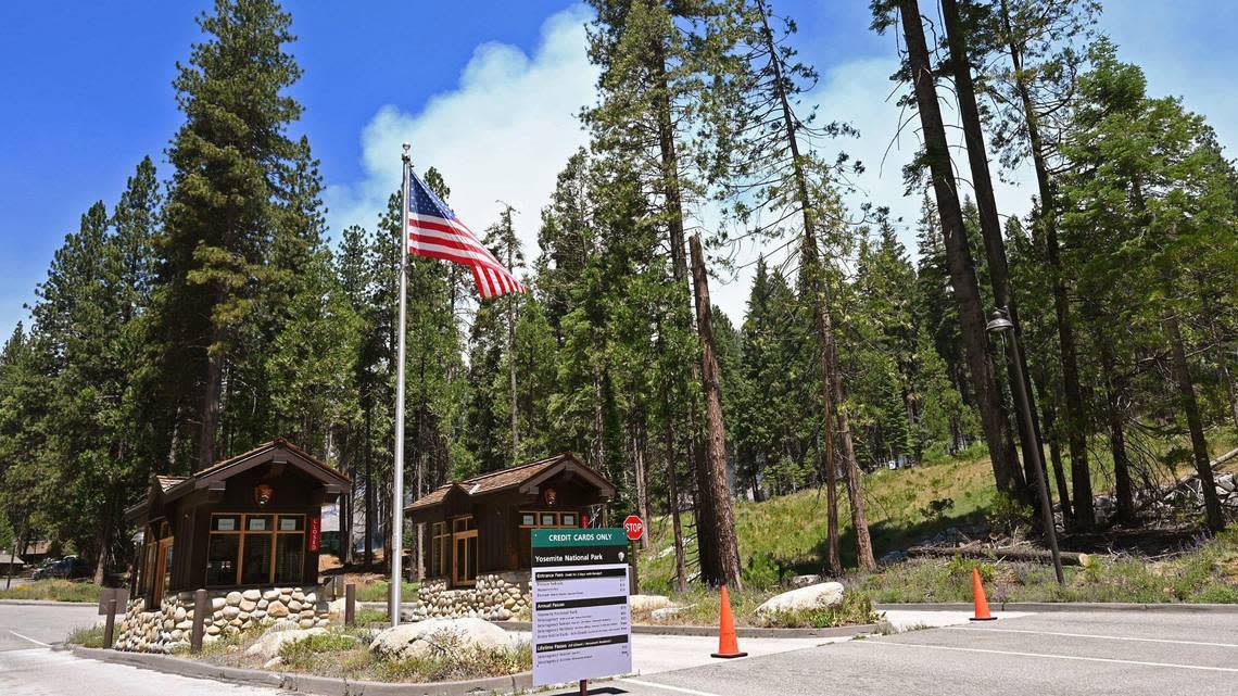 The South Gate entrance to Yosemite National Park is shown as the Washburn Fire burns in the distance on July 11, 2022.