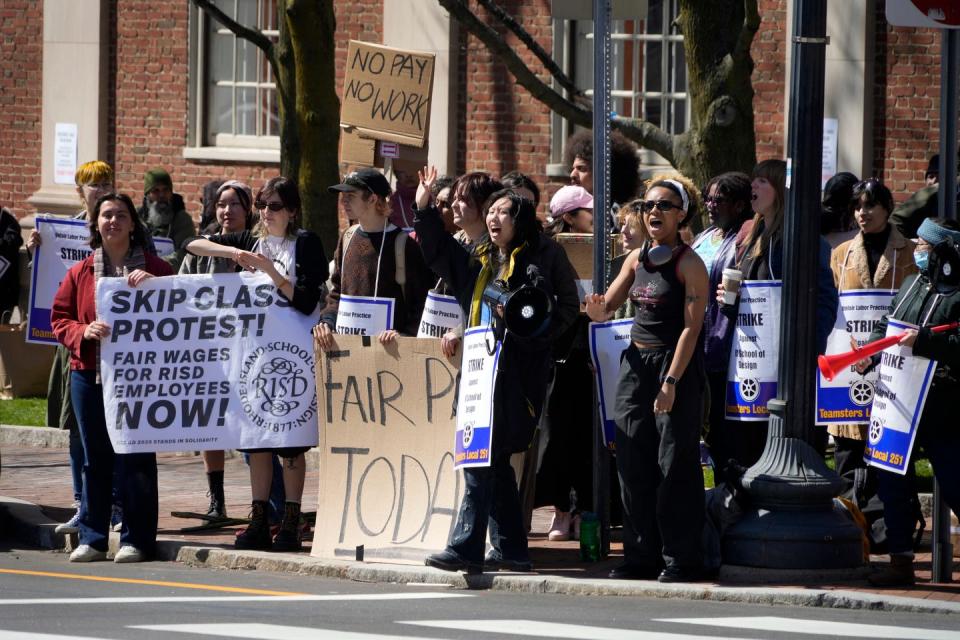 Union members and students supporting Rhode Island School of Design janitors and other union workers on strike gather at the corner of Waterman and North Main streets in Providence on April 3.