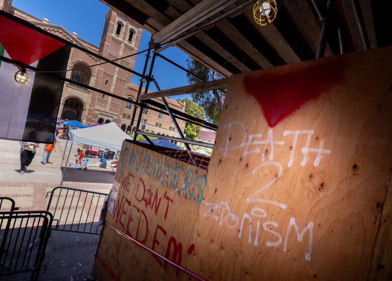 Los Angeles, CA - April 29: Graffiti at the Powell Library on the UCLA campus where pro-Palestinian demonstrators erected an encampment on the on Monday, April 29, 2024 in Los Angeles, CA. (Brian van der Brug / Los Angeles Times)