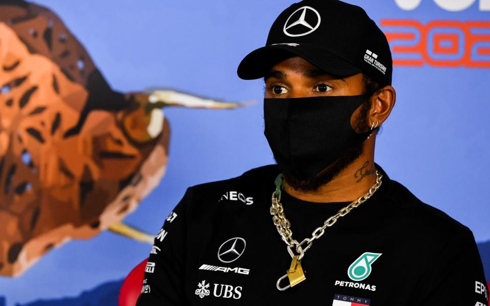 Lewis Hamilton speaks to the media - AP