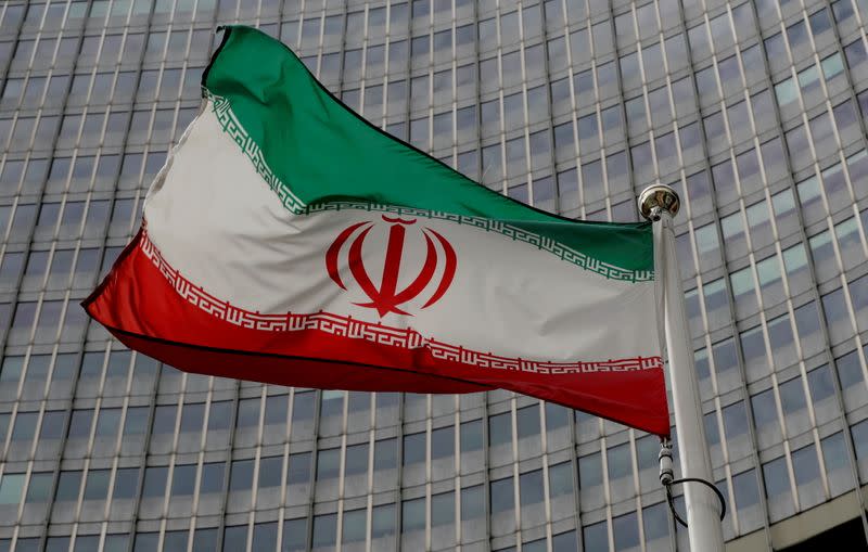 FILE PHOTO: An Iranian flag flutters in front of the IAEA headquarters in Vienna