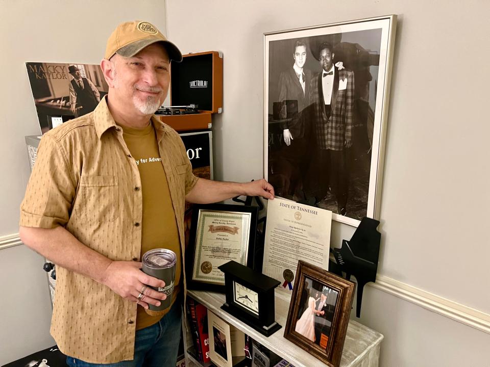 Makky Kaylor stands with his state resolution he received recently from the State House of Representatives honoring his contributions to the music industry.