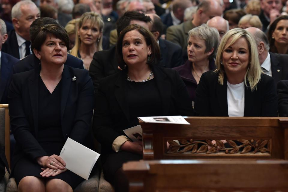 (L-R) Democratic Unionist Party (DUP) leader Arlene Foster, Irish Republican Sinn Fein party leader Mary Lou McDonald and Sinn Fein Northern Leader Michelle O'Neill attend the funeral service of journalist Lyra McKee (29), who was killed by a dissident republican paramilitary in Northern Ireland on April 18, at St Anne's Cathedral in Belfast on April 24, 2019. - Lyra McKee, 29, who chronicled the troubled history of Northern Ireland, was shot in the head on April 18, 2019, as rioters clashed with police in Londonderry, the second city of the British province. (Photo by Charles McQuillan / POOL / AFP)        (Photo credit should read CHARLES MCQUILLAN/AFP/Getty Images)