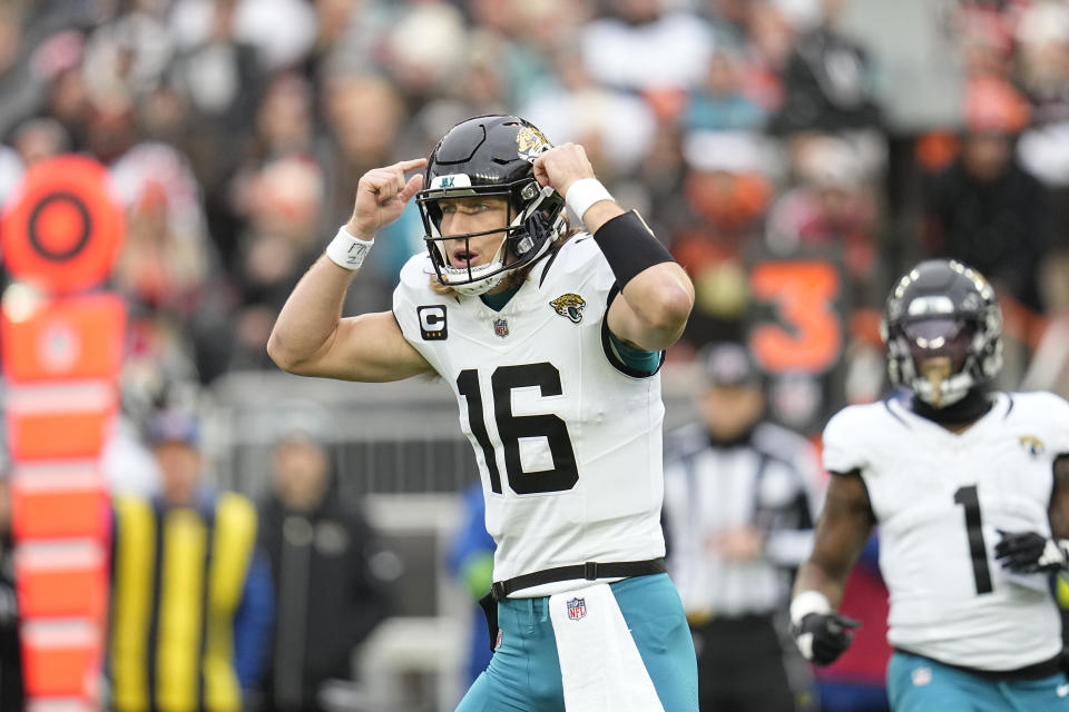 Jacksonville Jaguars quarterback Trevor Lawrence signals to his team during the first half of an NFL football game against the Cleveland Browns, Sunday, Dec. 10, 2023, in Cleveland. (AP Photo/Sue Ogrocki)