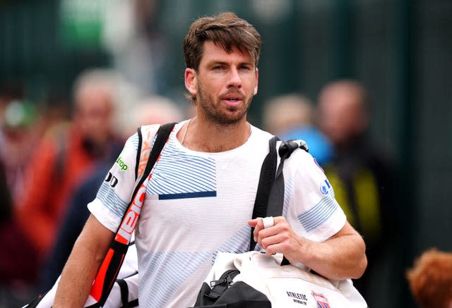 Cameron Norrie walks off court after losing to Jack Pinnington Jones 