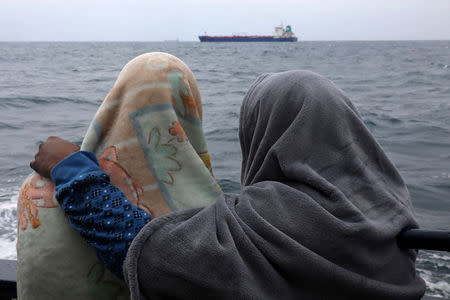 Migrants from Bangladesh are seen aboard the former fishing trawler Golfo Azzurro, following their rescue about thirty-two hours ago from their drifting dinghies by Spanish NGO Proactiva Open Arms, in central Mediterranean Sea, off the Libyan coast April 2, 2017. REUTERS/Yannis Behrakis