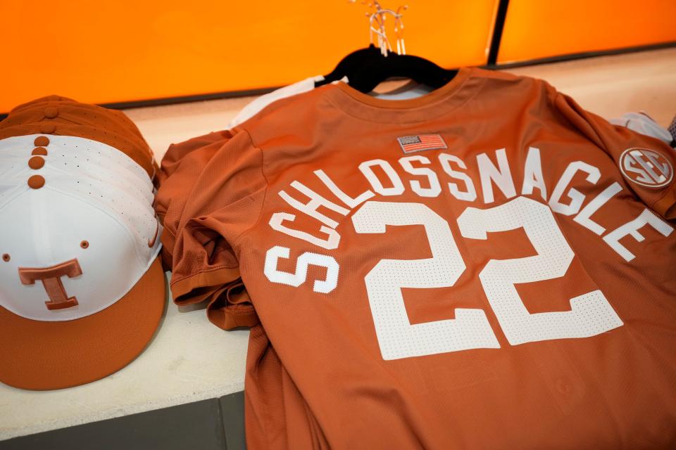 A Texas Longhorns jersey with the name of new head baseball coach Jim Schlossnagle sits during his introductory press conference Wednesday. He wore 22 as Texas A&M's head coach, as did David Pierce at Texas.