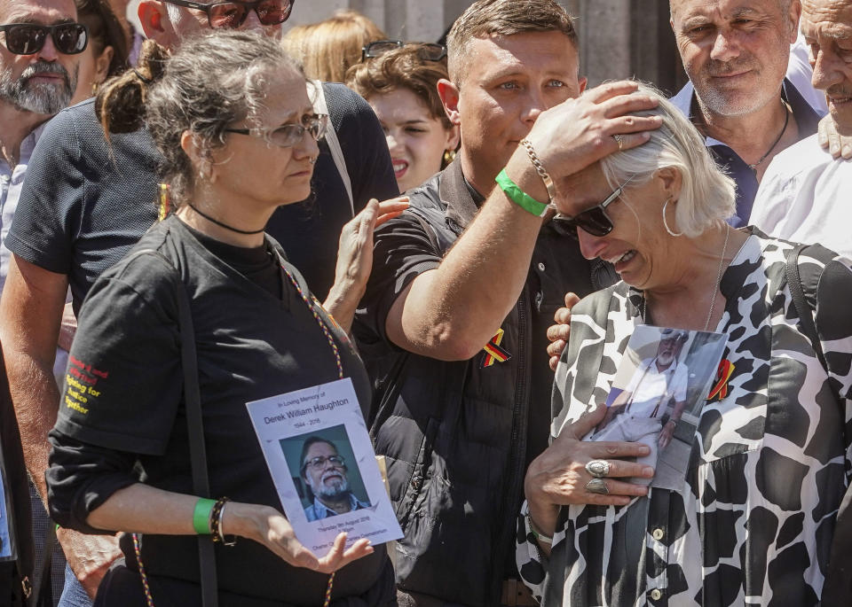 CORRECTS FATHER DENNIS TO HUSBAND BARRIE - Cressida Haughton, left, who's father Derek and Deborah Dennis who's husband Barrie died, react outside Central Hall in Westminster in London, after the publication of the Infected Blood Inquiry report, Monday May 20, 2024. British authorities and the country's public health service knowingly exposed tens of thousands of patients to deadly infections through contaminated blood and blood products, and hid the truth about the disaster for decades, an inquiry into the U.K.’s infected blood scandal found Monday. (Jeff Moore/PA via AP)