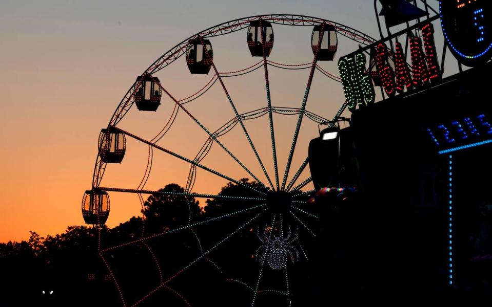 The sun sets at the N.C. State Fair in Raleigh, N.C., on Thursday, Oct. 12, 2023.