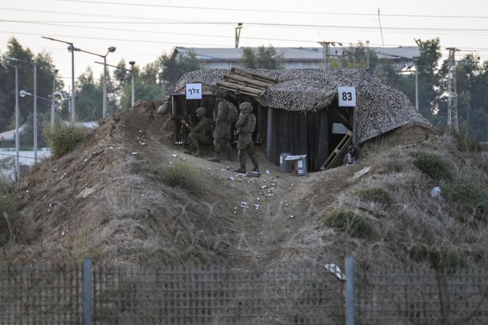 Israeli soldiers are deployed on the Israel-Gaza border, where the military says it carried out a series of airstrikes after Palestinians launched incendiary balloons into Israel, Friday, Sept. 22, 2023. The military said it struck three posts belonging to Hamas, the Islamic militant group that has controlled Gaza since 2007, in the latest violence to roil the territory as Palestinians stage routine protests by the border fence. (AP Photo/Tsafrir Abayov)