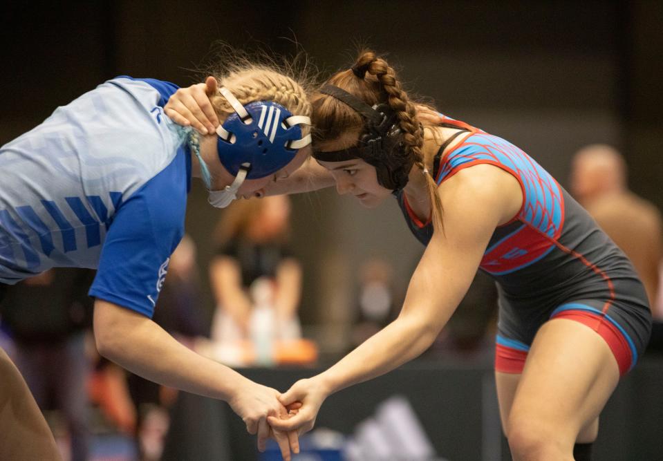 Gardner-Edgerton's Shelby Davis wrestles Shawnee Height's Madison Freeland for the 135 weight class title in 6-5A girls state wrestling on Thursday.