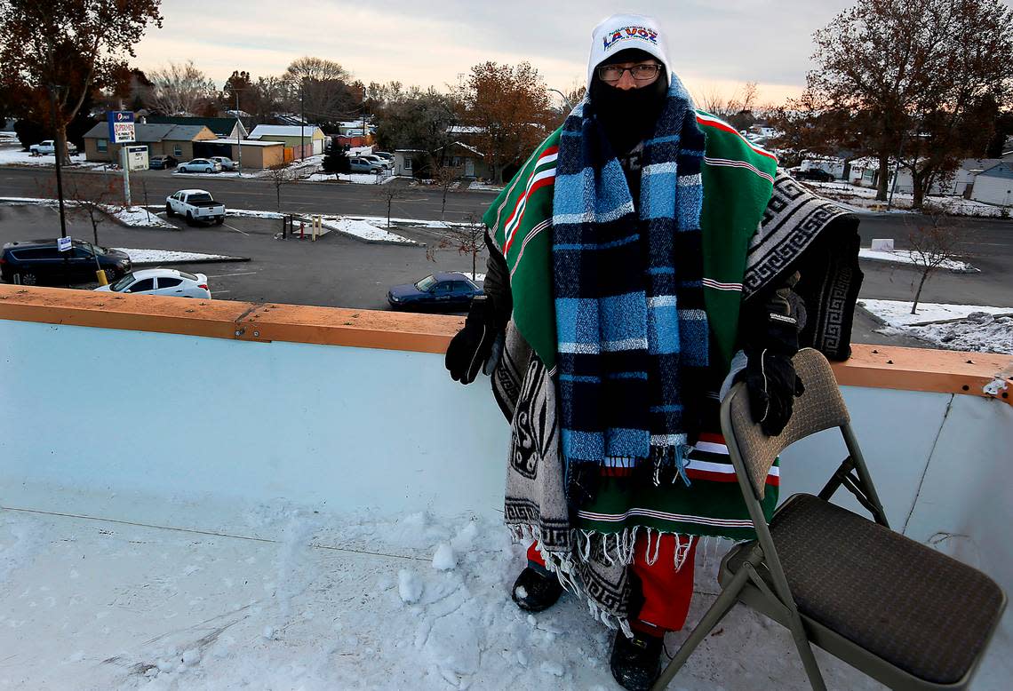 Gaudencio Felipe Sanchez, a local DJ with 96.1 La Ley radio station, wears layers of clothes and serapes while perched on the roof of the SuperMex El Pueblo Market in Pasco during his 23rd annual Christmas fundraiser for food, clothes and toys for those in need. His goal was to stay outside for 96.1 hours but was forced to cut his time short because of dangerously frigid temperatures.