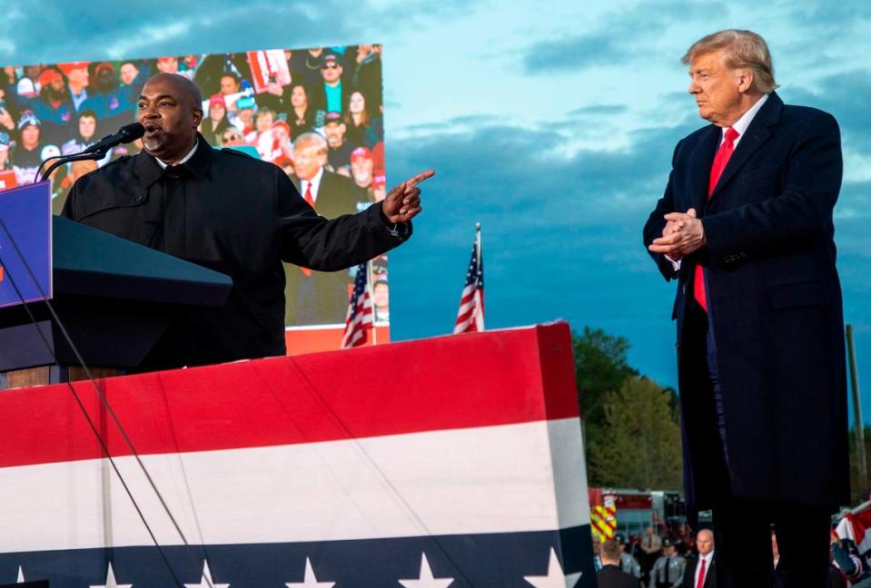 Lt. Gov. Mark Robinson and former President Donald Trump share the stage during a rally in Selma Saturday, April 9, 2022.