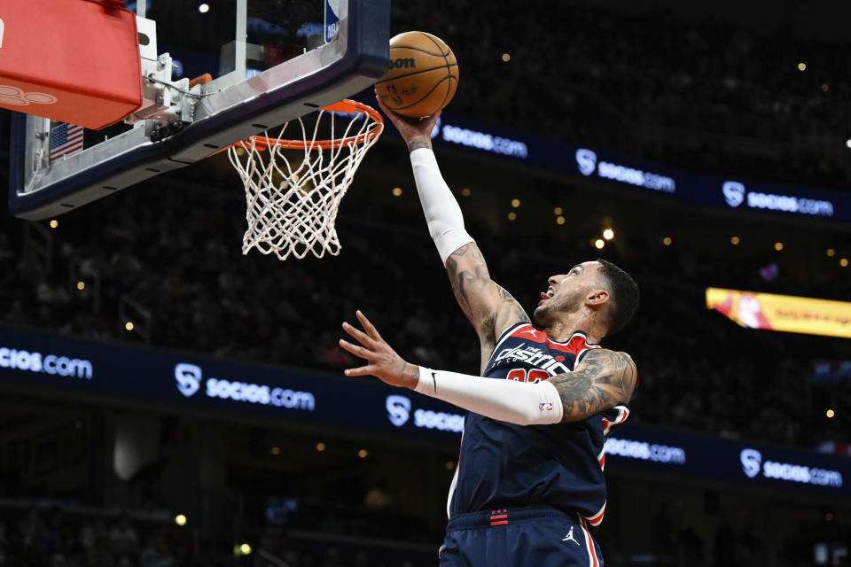 Washington Wizards forward Kyle Kuzma (33) goes to the basket for a layup during the first half of an NBA basketball game against the Toronto Raptors, Saturday, March. 4, 2023, in Washington. (AP Photo/Terrance Williams)