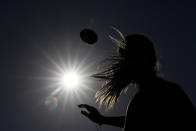 Shale Harris, 15, throws a pass as she tries out for the Redondo Union High School girls flag football team on Thursday, Sept. 1, 2022, in Redondo Beach, Calif. Southern California high school sports officials will meet on Thursday, Sept. 29, to consider making girls flag football an official high school sport. This comes amid growth in the sport at the collegiate level and a push by the NFL to increase interest. (AP Photo/Ashley Landis)