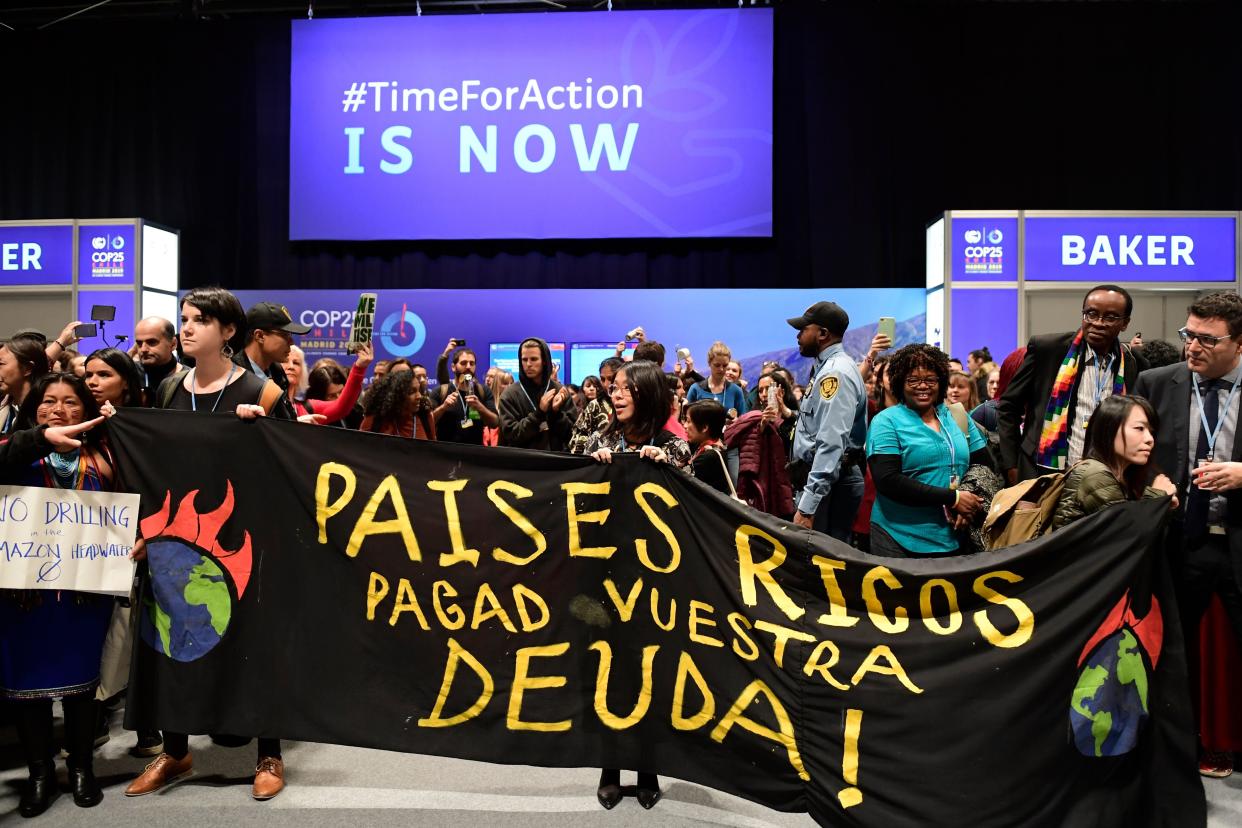 Campaigners at Cop25 in Madrid urge rich countries to pay debts and stop deforestation in the Amazon (AFP/Getty)