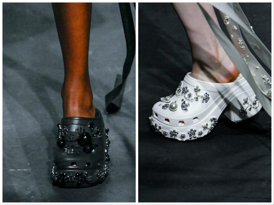 Model wearing black Crocs with black rhinestone embellishments (left), model wearing white Crocs with rhinestone and pearl embellishments