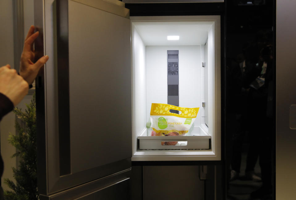 A refrigerated compartment allows people to deliver perishable food in the Smart Door & Fresh Keeper concept home door at the LG booth during the CES tech show, Tuesday, Jan. 7, 2020, in Las Vegas. (AP Photo/John Locher)