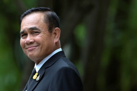 FILE PHOTO: Thai Prime Minister Prayuth Chan-ocha smiles before speaking to the media at Government House in Bangkok