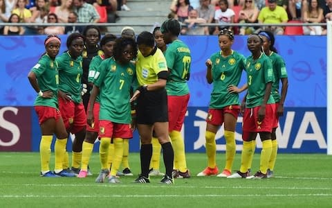 Gabrielle Aboudi Onguene of Cameroon speaks with Referee Qin Liang during their tumultuous, VAR incident-packed, match with England - Credit: GETTY IMAGES