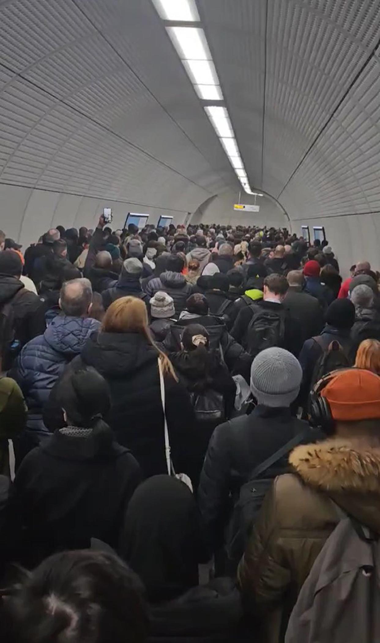 A screengrab taken with permission of commuters at Tottenham Court Road underground station at 8am on Wednesday 15 March, as industrial action closed the London Underground network (PA)